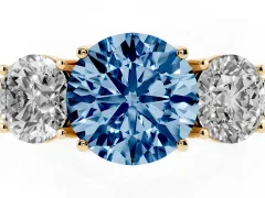 Fancy Blue Round Cut Diamond Three-Stone Engagement Ring Set in Yellow gold with Milgrain Pavé Band