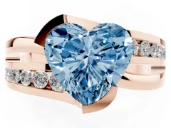 Fancy Blue Heart Cut Diamond Solitaire Ring Set in Rose gold with Channel Set Split Shank and Tension Prongs
