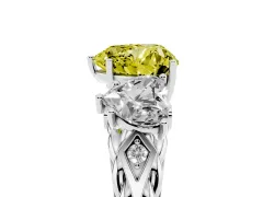 Fancy Yellow Heart Cut Diamond Three-Stone Ring Set in Platinum with Braided Band