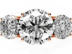 Round Cut Diamond Three-Stone Engagement Ring Set in Rose gold with Milgrain Pavé Band
