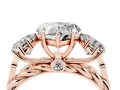 Heart Cut Diamond Three-Stone Ring Set in Rose gold with Braided Band
