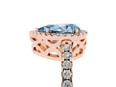 Fancy Blue Pear Cut Diamond Halo Ring Set in Rose gold with Pavé Shoulders and Halo-Framed Center