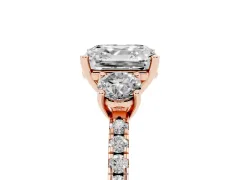 Asscher Cut Diamond Three-Stone Ring Set in Rose gold with Pavé Band and Graduated Sides