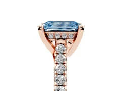 Fancy Blue Emerald Cut Diamond Solitaire Ring Set in Rose gold with Brilliant Pavé Band and Prong Setting