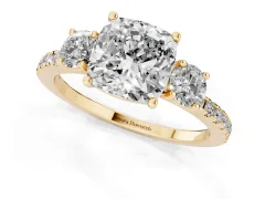 Cushion Cut Diamond Three-Stone Ring Set in Yellow gold with Pavé Band and Graduated Sides