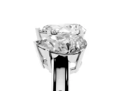 Pear Cut Diamond Three-Stone Ring Set in White gold with Channel-Set Band and Prong Settings