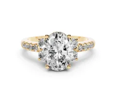 Oval Cut Diamond Three-Stone Pavé Ring Set in Yellow gold with Prong Setting