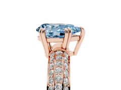 Fancy Blue Pear Cut Diamond Solitaire Ring Set in Rose gold with Multi-Row Round Pavé Band and Prong Setting