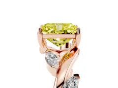 Fancy Yellow Radiant Cut Diamond Solitaire Ring Set in Rose gold with Twisted Marquise Accent Band