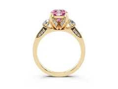 Fancy Pink Cushion Cut Diamond Three-Stone Ring Set in Yellow gold with Pavé Band and Smaller Side Stones