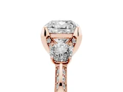 Cushion Cut Diamond Three-Stone Ring Set in Rose gold with Pavé Band and Smaller Side Stones