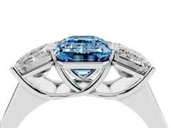 Fancy Blue Emerald Cut Diamond Three-Stone Ring Set in White gold with Plain Polished Band
