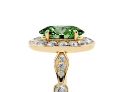 Fancy Green Oval Cut Diamond Halo Engagement Ring Set in Yellow gold with Twisted Band and Prong Setting
