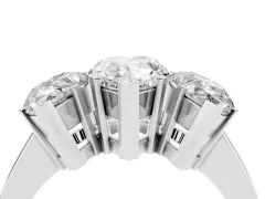 Pear Cut Diamond Three-Stone Ring Set in White gold with Channel-Set Band and Prong Settings