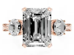 Emerald Cut Diamond Three-Stone Ring Set in Rose gold with Pavé Band and Smaller Side Stones