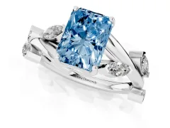 Fancy Blue Radiant Cut Diamond Solitaire Ring Set in White gold with Twisted Marquise Accent Band