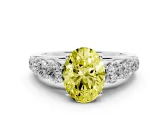 Fancy Yellow Oval Cut Diamond Solitaire Ring Set in Platinum with Pavé-Set Band and Prong Setting