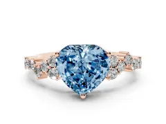 Fancy Blue Heart Cut Diamond Ring Set in Rose gold with Scattered Round Accents