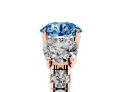 Fancy Blue Round Cut Diamond Three-Stone Ring Set in Rose gold with Pavé Band