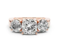 Cushion Cut Diamond Three-Stone Ring Set in Rose gold with Round Side Stones and Classic Band