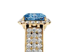 Fancy Blue Radiant Cut Diamond Halo Ring Set in Yellow gold with Pavé Band and Raised Center Setting