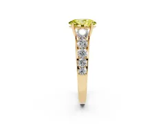 Fancy Yellow Oval Cut Diamond Solitaire Ring Set in Yellow gold with Pavé-Set Band and Prong Setting