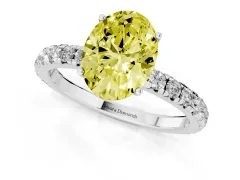 Fancy Yellow Oval Cut Diamond Pavé Solitaire Engagement Ring Set in White gold with Prong Setting