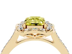 Fancy Yellow Emerald Cut Diamond Halo Ring Set in Yellow gold with Pavé-Lined Shoulders and Prong Setting