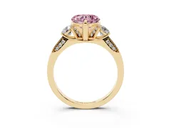 Fancy Pink Heart Cut Diamond Three-Stone Ring Set in Yellow gold with Pavé Band and Smaller Side Stones