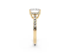 Radiant Cut Diamond Solitaire Engagement Ring Set in Yellow gold with Pavé Band and Prong Setting