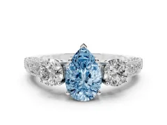Fancy Blue Pear Cut Diamond Three-Stone Ring Set in Platinum with Round Side Stones and Pavé Band