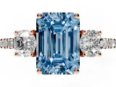 Fancy Blue Emerald Cut Diamond Three-Stone Ring Set in Rose gold with Pavé Band and Graduated Sides