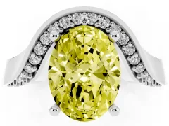 Fancy Yellow Oval Cut Diamond Solitaire Engagement Ring Set in White gold with Pavé Shoulders