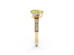 Fancy Yellow Pear Cut Diamond Three-Stone Ring Set in Yellow gold with Round Side Stones and Pavé Band
