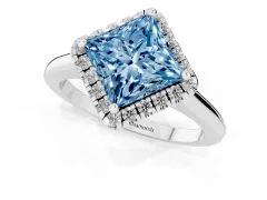 Fancy Blue Princess Cut Diamond Halo Engagement Ring Set in White gold with Pavé Band and Rising Shoulders