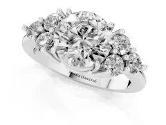 Round Cut Diamond Solitaire Ring Set in White gold with Cluster Accents on Each Side