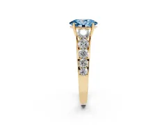 Fancy Blue Oval Cut Diamond Solitaire Ring Set in Yellow gold with Pavé-Set Band and Prong Setting