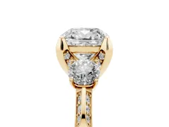 Cushion Cut Diamond Three-Stone Ring Set in Yellow gold with Pavé Band and Smaller Side Stones