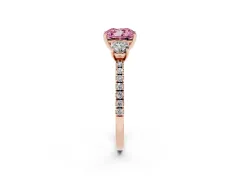 Fancy Pink Cushion Cut Diamond Three-Stone Ring Set in Rose gold with Pavé Band and Graduated Sides