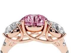 Fancy Pink Round Cut Diamond Three-Stone Ring Set in Rose gold with Pavé Band