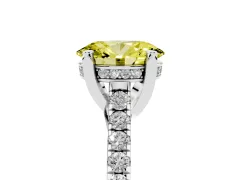 Fancy Yellow Oval Cut Diamond Solitaire Ring Set in White gold with Brilliant Pavé Band and Prong Setting