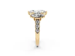 Marquise Cut Diamond Three-Stone Ring Set in Yellow gold with Pavé Band