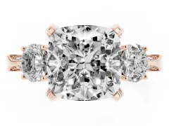 Cushion Cut Diamond Three-Stone Ring Set in Rose gold with Pavé Band and Smaller Side Stones