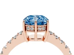 Fancy Blue Cushion Cut Diamond Solitaire Engagement Ring Set in Rose gold with Pavé Band and Prong Setting