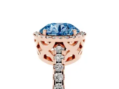 Fancy Blue Round Cut Diamond Halo Ring Set in Rose gold with Pavé Shoulders and Halo-Framed Center