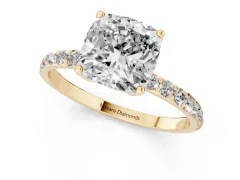 Cushion Cut Diamond Solitaire Engagement Ring Set in Yellow gold with Round Pavé Band and Prong Setting