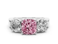 Fancy Pink Cushion Cut Diamond Three-Stone Ring Set in Platinum with Round Side Stones and Classic Band