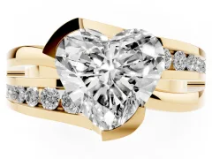 Heart Cut Diamond Solitaire Ring Set in Yellow gold with Channel Set Split Shank and Tension Prongs