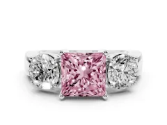Fancy Pink Princess Cut Diamond Three-Stone Ring Set in White gold with Round Side Stones and Classic Band