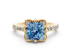 Fancy Blue Cushion Cut Diamond Solitaire Ring Set in Yellow gold with Pavé Band and Floral Prong Setting